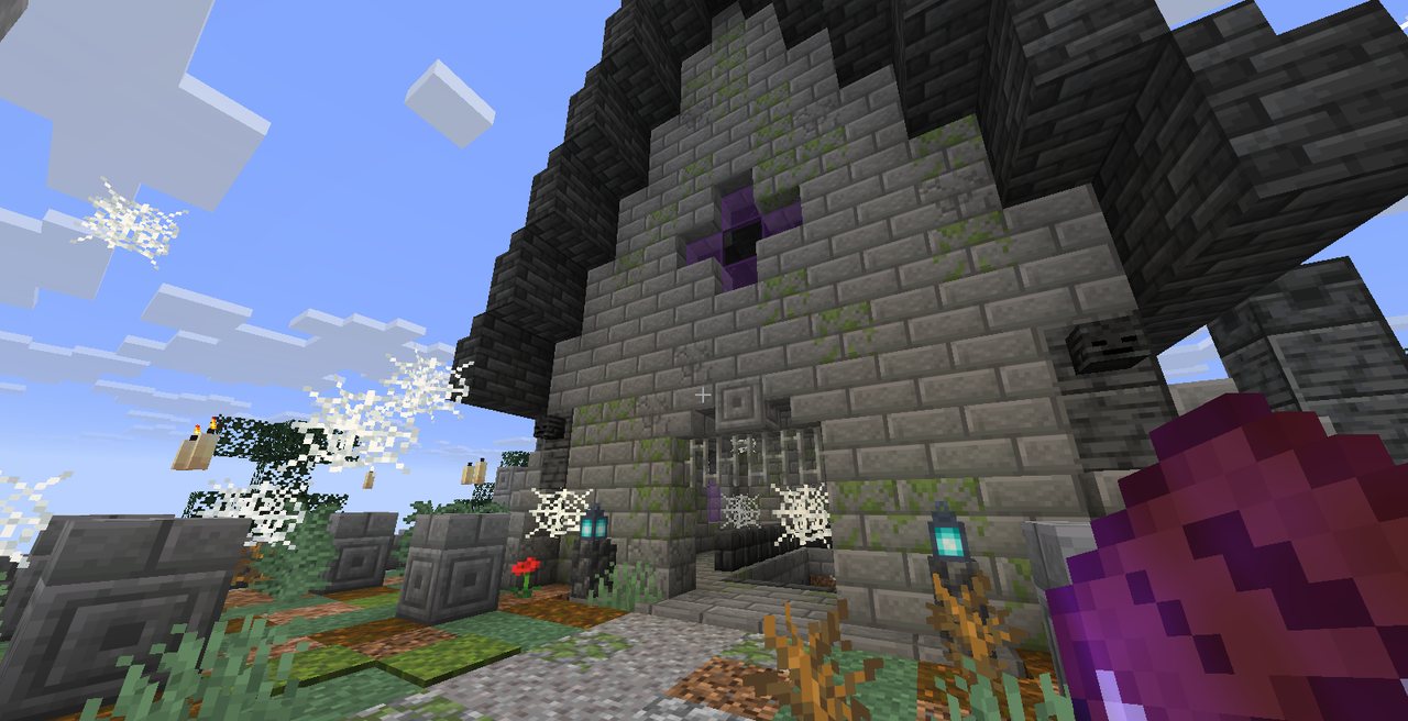 A dark stone mausoleum with a steep roof in a graveyard full of cobwebs and soul lanterns