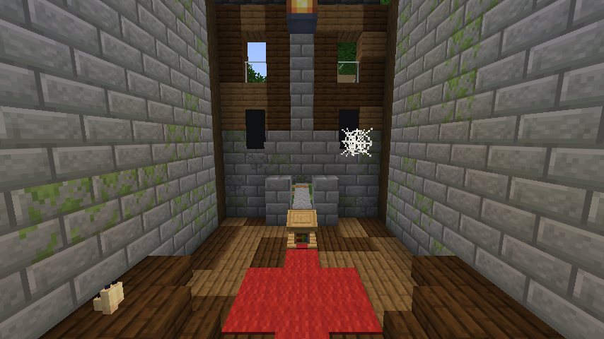A tall stone hall with a red carpet leading to a lectern before a fireplace, with banners and high windows